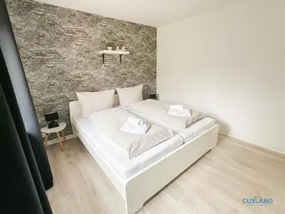 Ein Bett oder Betten in einem Zimmer der Unterkunft Auszeit am Grünstrand