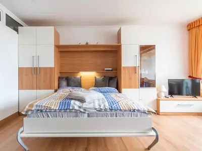 Ein Bett oder Betten in einem Zimmer der Unterkunft Strandnahe Fewo inkl Pool, Whirlpool, Sauna & Strandkorb 234