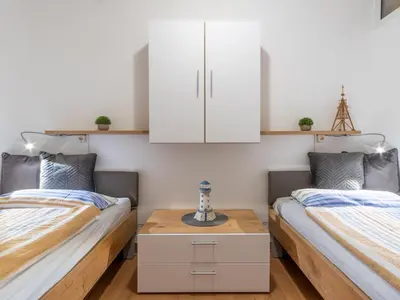 Ein Bett oder Betten in einem Zimmer der Unterkunft Strandnahe Fewo inkl Pool, Whirlpool, Sauna & Strandkorb 234