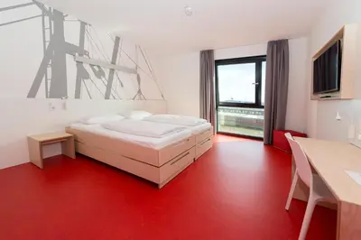 Ein Bett oder Betten in einem Zimmer der Unterkunft havenhostel Cuxhaven