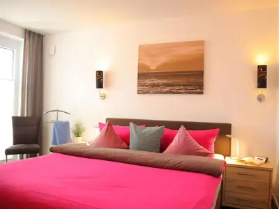 Ein Bett oder Betten in einem Zimmer der Unterkunft Ferienwohnung Nordseetraum