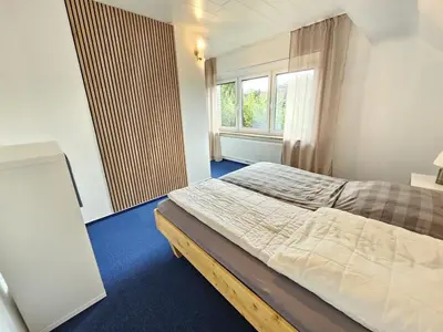 Ein Bett oder Betten in einem Zimmer der Unterkunft Strandnixe 2