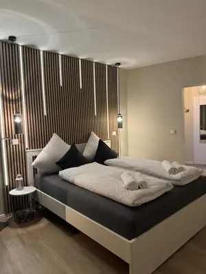 Ein Bett oder Betten in einem Zimmer der Unterkunft Traumhafte Ferienwohnung - direkter Meerblick - 50m zum Strand in Cuxhaven Duhnen in 1A Lage im Haus Seehütte