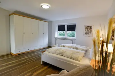 Ein Bett oder Betten in einem Zimmer der Unterkunft Haus Eschenhof EH02