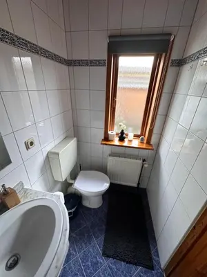 Ein Badezimmer in der Unterkunft Apartment Holzhaus