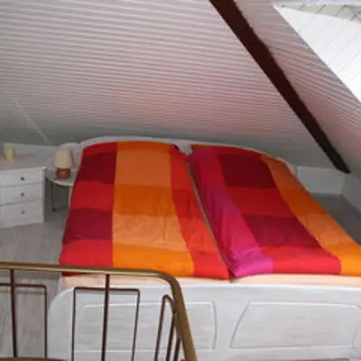Ein Bett oder Betten in einem Zimmer der Unterkunft Fewo Leopold - Ferienwohnung 1