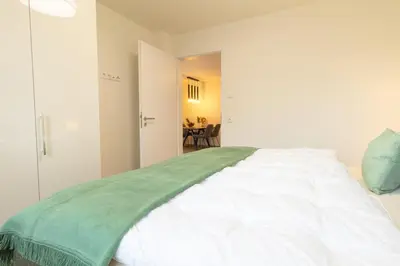 Ein Bett oder Betten in einem Zimmer der Unterkunft Dorumer Sielhuus 4