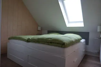 Ein Bett oder Betten in einem Zimmer der Unterkunft Vinnenhus Wohnung 06