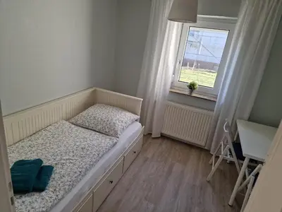 Ein Bett oder Betten in einem Zimmer der Unterkunft Ferienhaus To Huus