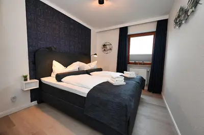 Ein Bett oder Betten in einem Zimmer der Unterkunft Nordseeoase