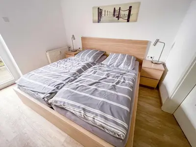 Ein Bett oder Betten in einem Zimmer der Unterkunft Appartementhaus Nige Ooge Wohnung Nr 1