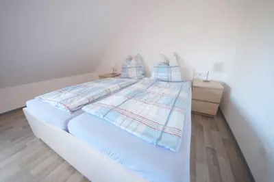 Ein Bett oder Betten in einem Zimmer der Unterkunft Appartementhaus Nige Ooge Wohnung Nr 12