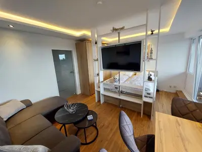 Ein Bett oder Betten in einem Zimmer der Unterkunft FeWo Terrassenhaus Duhnen mit Meerblick - 6. Etage