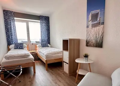 Ein Bett oder Betten in einem Zimmer der Unterkunft Frische Brise FeWo 15.03