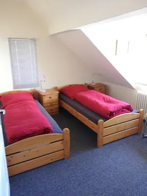 Ein Bett oder Betten in einem Zimmer der Unterkunft Stranddüne