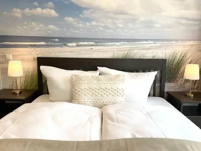 Ein Bett oder Betten in einem Zimmer der Unterkunft Haus Nordseebrandung FeWo 9