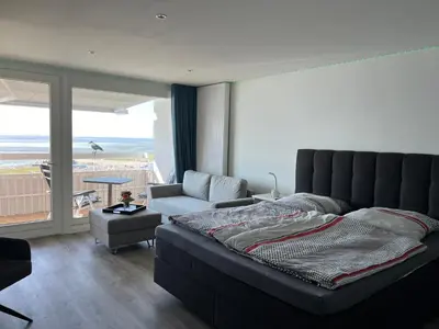 Ein Bett oder Betten in einem Zimmer der Unterkunft Ferienwohnung Sea View