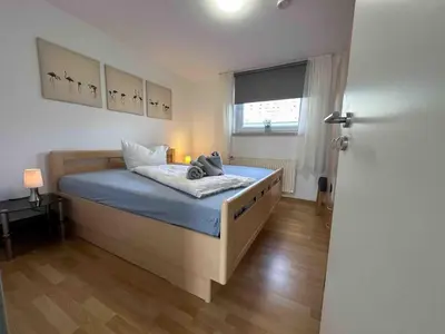 Ein Bett oder Betten in einem Zimmer der Unterkunft Haus Sonneneck 4