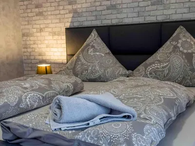 Ein Bett oder Betten in einem Zimmer der Unterkunft Haus Sonneneck 1
