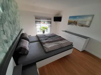 Ein Bett oder Betten in einem Zimmer der Unterkunft Exklusives Haus am See