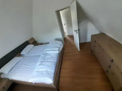 Ein Bett oder Betten in einem Zimmer der Unterkunft Häuschen am See