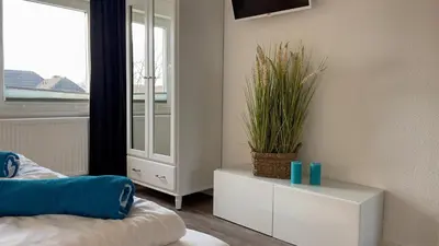Ein Bett oder Betten in einem Zimmer der Unterkunft Watt´n Traum Wohnung 2