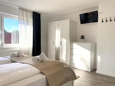 Ein Bett oder Betten in einem Zimmer der Unterkunft Watt´n Traum Wohnung 2