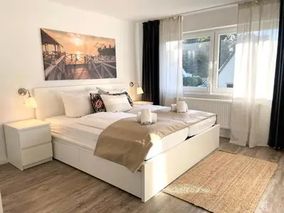 Ein Bett oder Betten in einem Zimmer der Unterkunft Watt´n Traum Wohnung 2