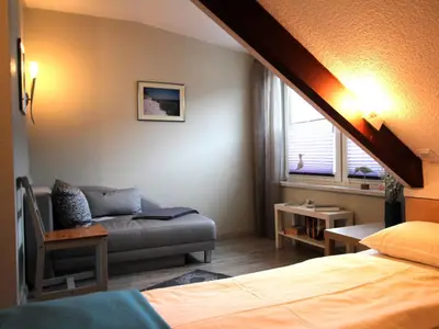 Ein Bett oder Betten in einem Zimmer der Unterkunft Residenz kleine Krabbe
