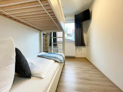 Ein Bett oder Betten in einem Zimmer der Unterkunft Haus Wernerwald FeWo 6