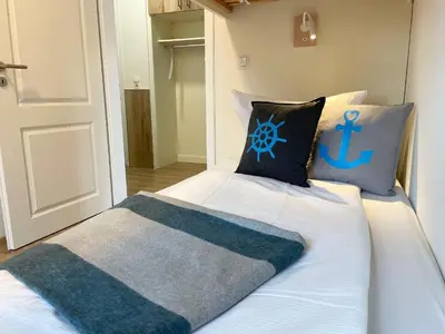 Ein Bett oder Betten in einem Zimmer der Unterkunft Haus Wernerwald FeWo 6