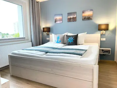 Ein Bett oder Betten in einem Zimmer der Unterkunft Haus Wernerwald FeWo 6