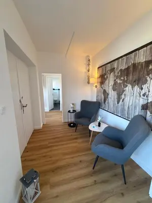 Ein Sitzbereich in der Unterkunft Haus Sandbank