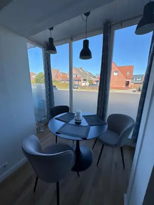 Ein Sitzbereich in der Unterkunft Haus Sandbank