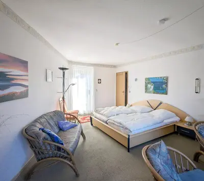 Ein Bett oder Betten in einem Zimmer der Unterkunft Ferienwohnungen Ingelore Kunze