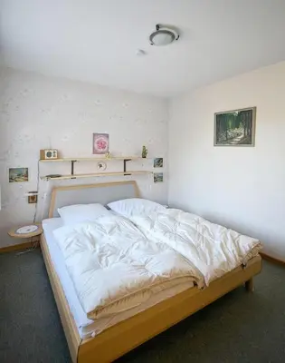 Ein Bett oder Betten in einem Zimmer der Unterkunft Ferienwohnungen Ingelore Kunze