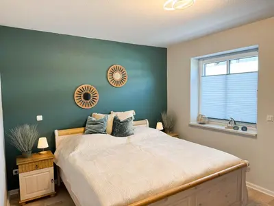 Ein Bett oder Betten in einem Zimmer der Unterkunft Haus Seehafen Apartment 2 3