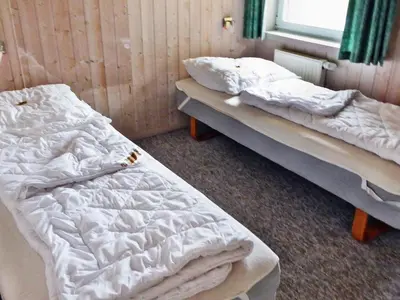 Ein Bett oder Betten in einem Zimmer der Unterkunft 12 person holiday home in Otterndorf