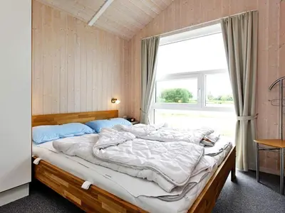 Ein Bett oder Betten in einem Zimmer der Unterkunft 12 person holiday home in Otterndorf