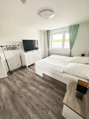 Ein Bett oder Betten in einem Zimmer der Unterkunft Seaside Döse Appartement - Free Parking & WiFi