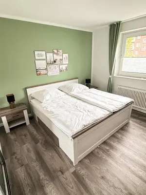 Ein Bett oder Betten in einem Zimmer der Unterkunft Seaside Döse Appartement - Free Parking & WiFi