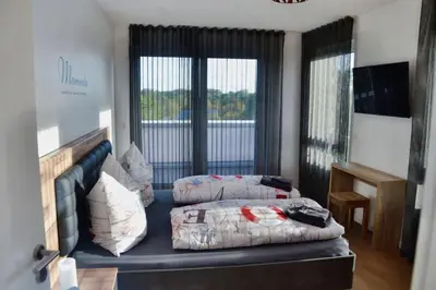 Ein Bett oder Betten in einem Zimmer der Unterkunft Meeresleuchten Duhnen-Entrée 19