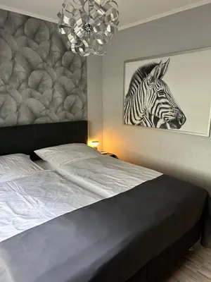 Ein Bett oder Betten in einem Zimmer der Unterkunft Apartment MeerZeit Wohnung 207