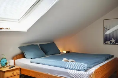 Ein Bett oder Betten in einem Zimmer der Unterkunft Haus Strandflieder