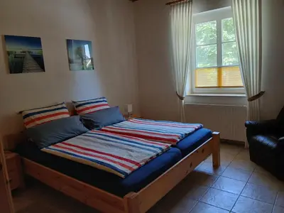 Ein Bett oder Betten in einem Zimmer der Unterkunft Ferienhof Eckelehe, Wremen