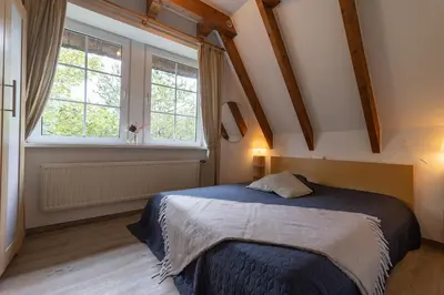Ein Bett oder Betten in einem Zimmer der Unterkunft Appartement Achtern Diek 2-27