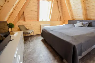 Ein Bett oder Betten in einem Zimmer der Unterkunft Ferienhaus Mellumplate 23