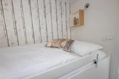 Ein Bett oder Betten in einem Zimmer der Unterkunft Hausboot 