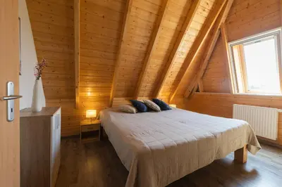 Ein Bett oder Betten in einem Zimmer der Unterkunft Ferienhaus Mellumplate 52