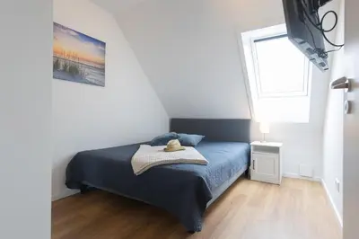 Ein Bett oder Betten in einem Zimmer der Unterkunft Ferienreihenhaus Lale Andersen 4c